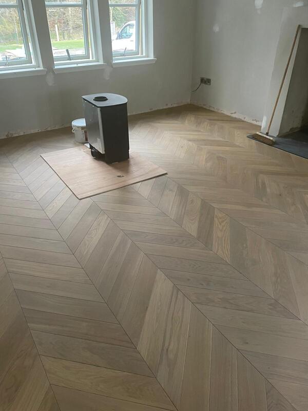 chevron parquet wood flooring in Living room 