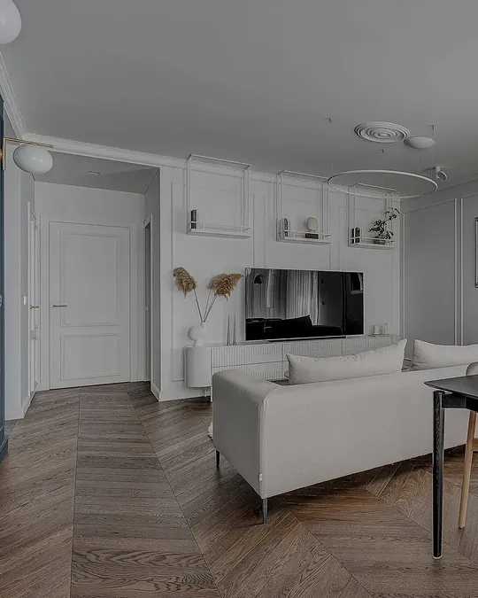Chevron parquet flooring in a bright living room, supplied and fitted by Hoff Parquet