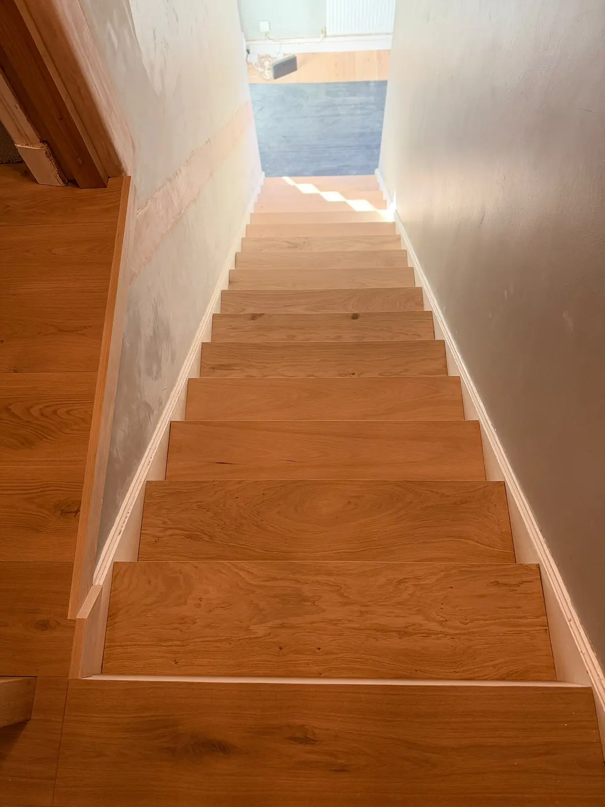 View down the oak-clad staircase from the top landing