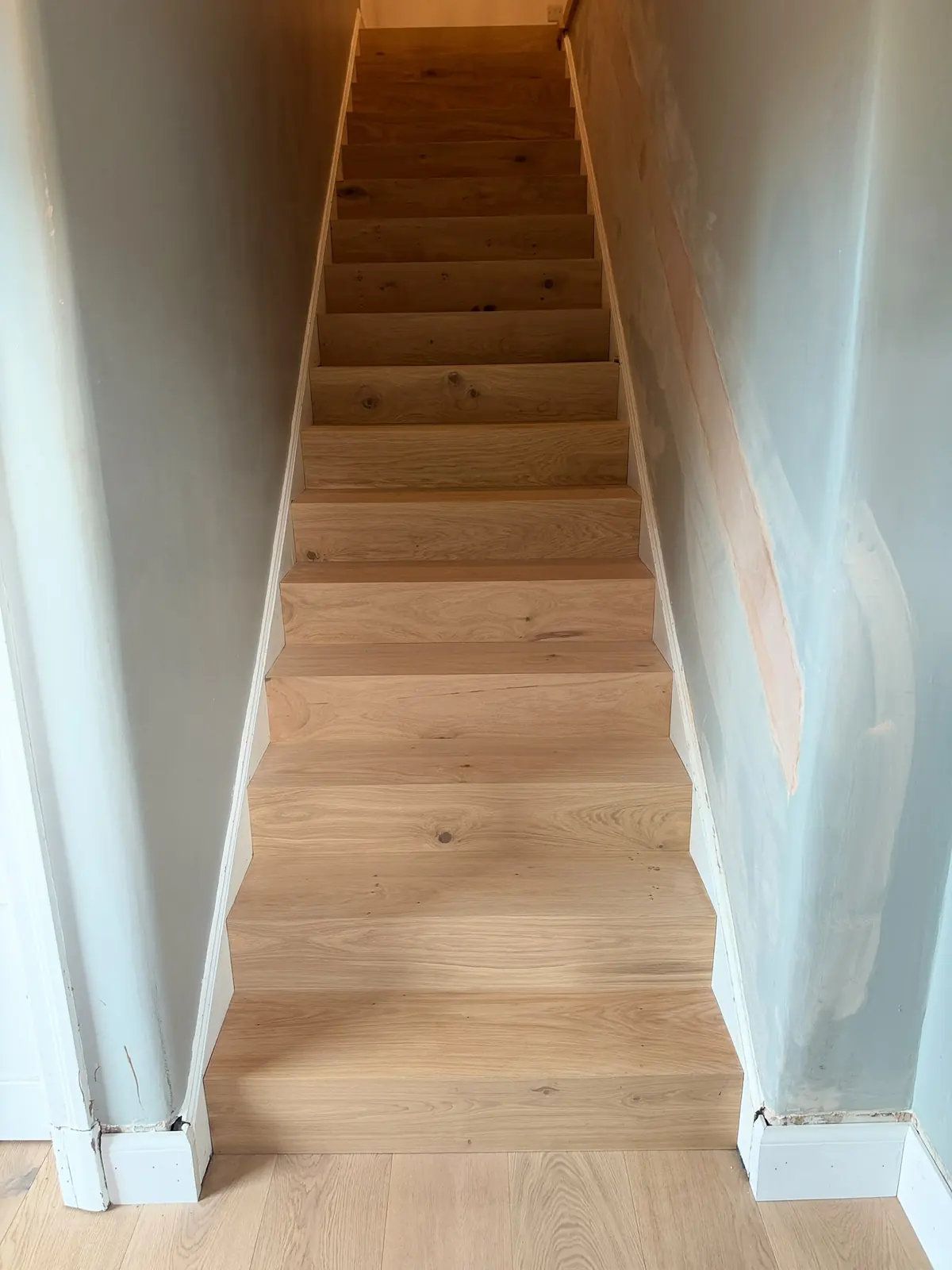Full flight of oak-clad stairs in a Dalkeith home
