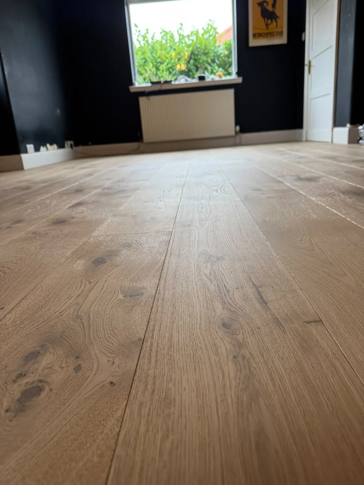 Sun Beam wide plank engineered oak flooring in a bedroom in Dalkeith