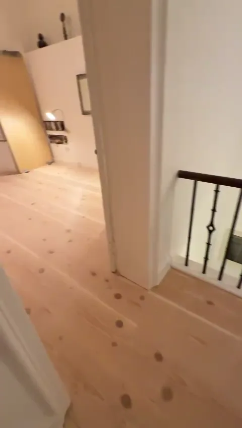 Douglas fir planks running the full length of a New Town hallway