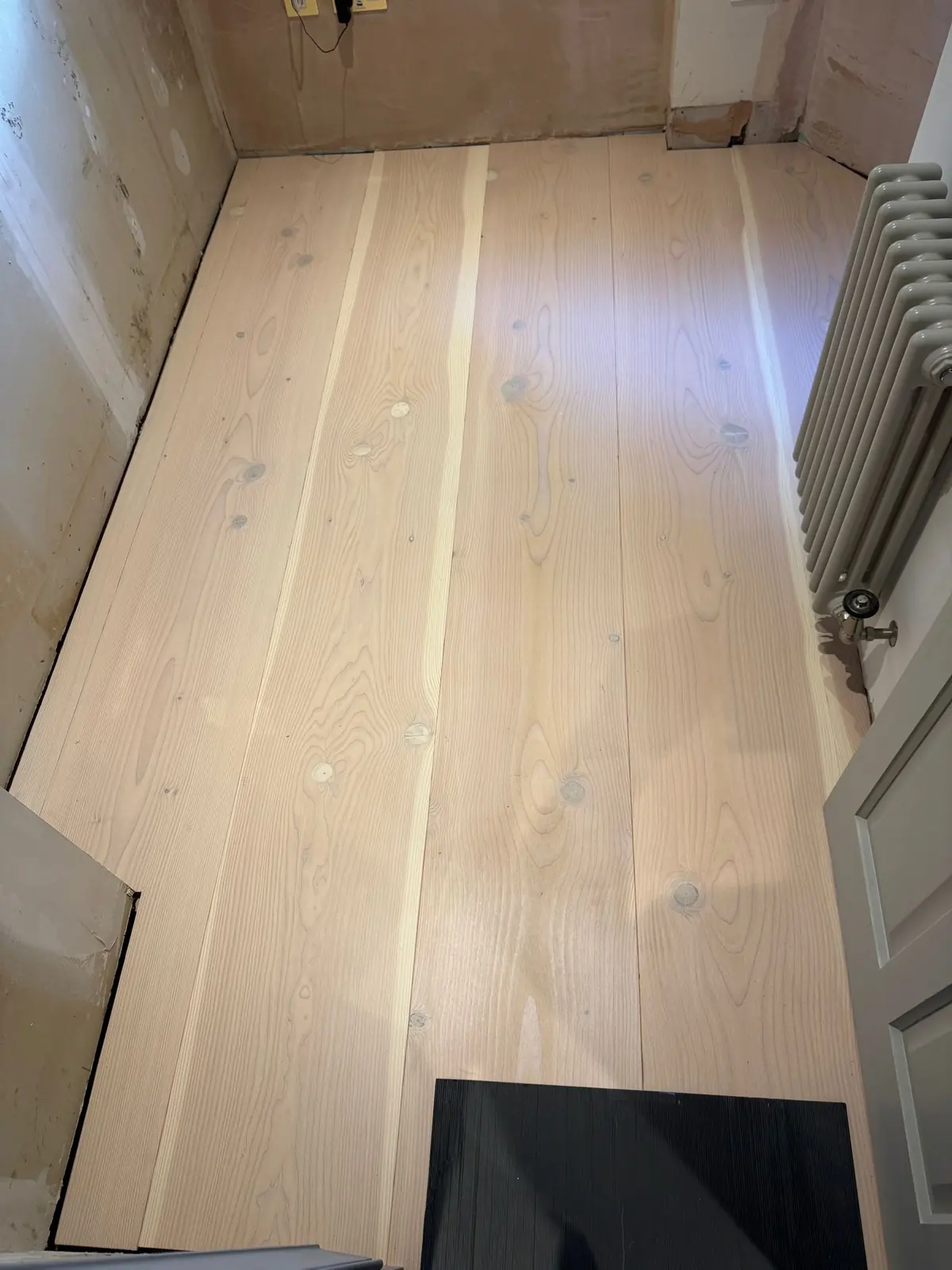 300mm Douglas fir wide planks in a small bedroom