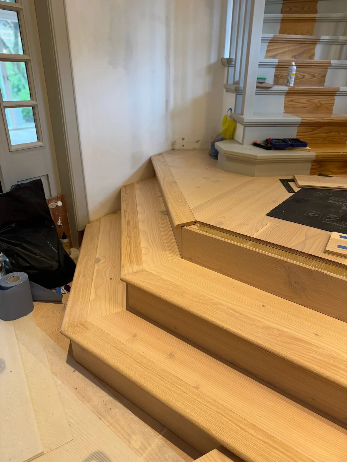Douglas fir step cladding with nosings being fitted