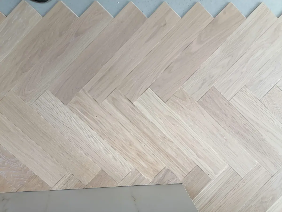Close-up of clean, uniform premium grade oak herringbone blocks
