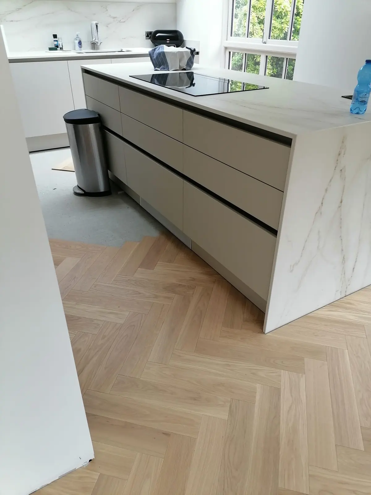 Herringbone parquet continuing through a doorway