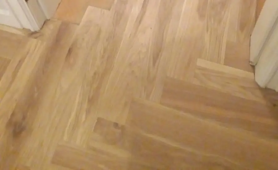 First herringbone rows laid at the front door over new plywood