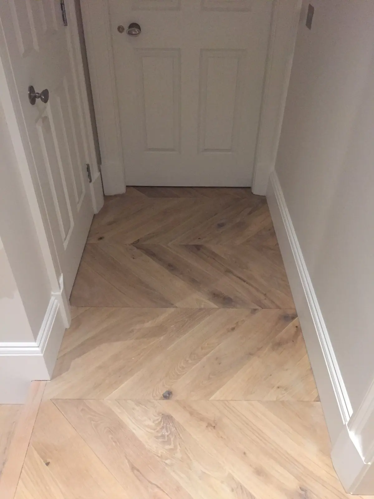 Chevron parquet in a small lobby