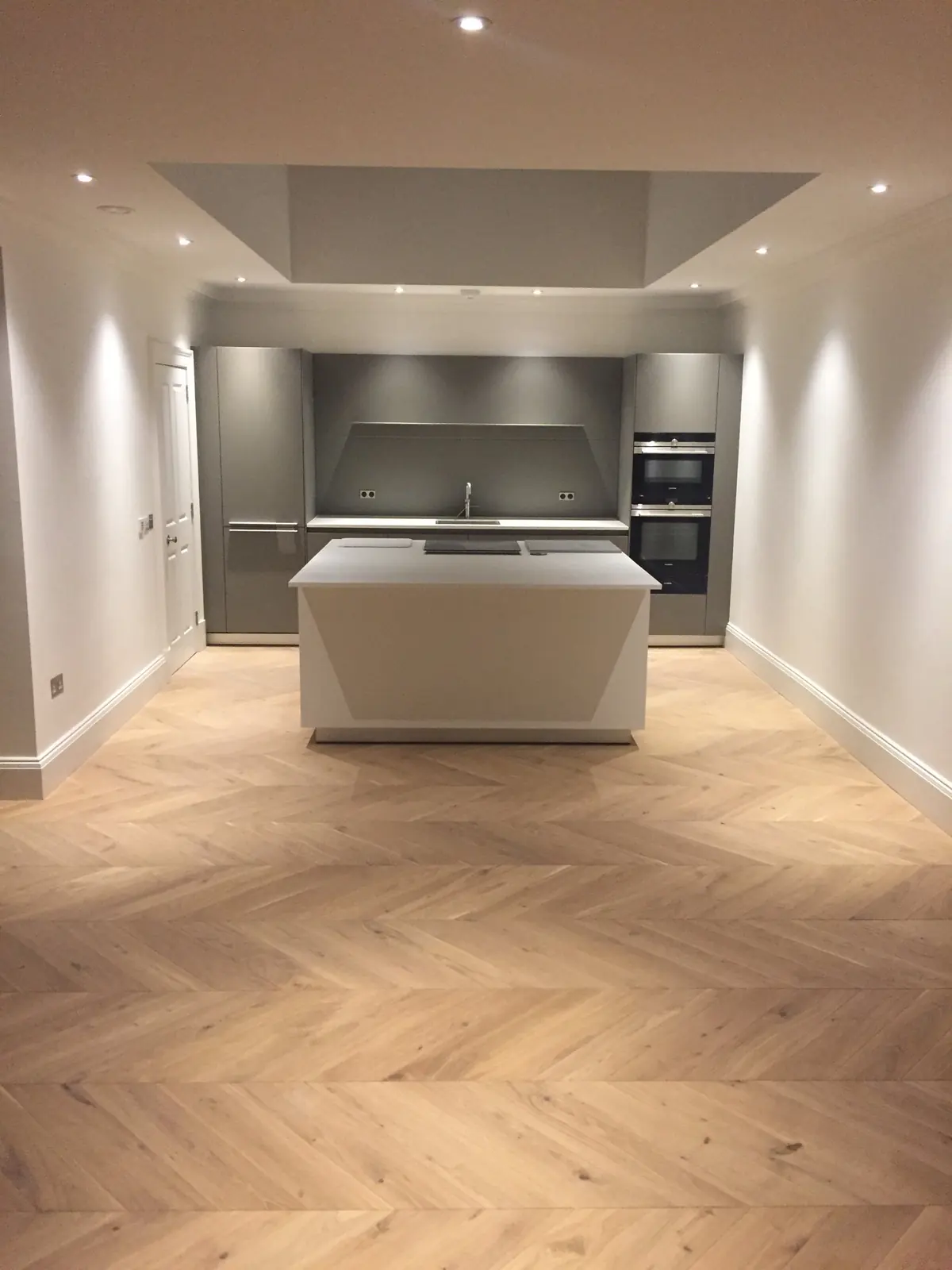 Light Oak chevron parquet in an open-plan kitchen in a West End Edinburgh apartment