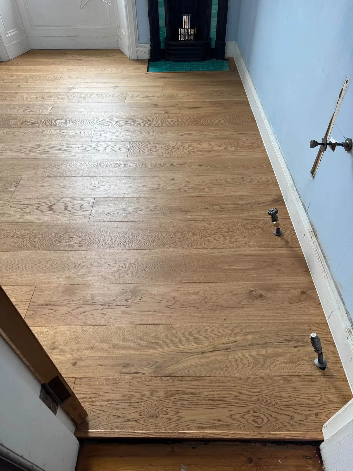 Oak planks at a bedroom doorway with a matching oak threshold