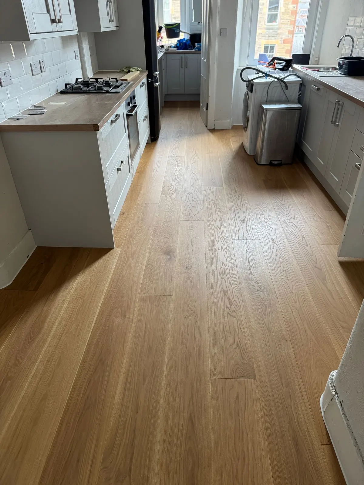 Engineered oak flooring in a galley kitchen in Edinburgh