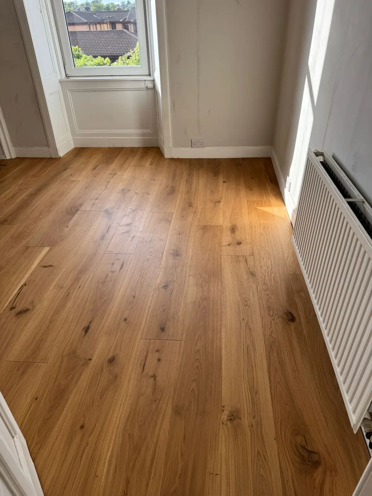 No. 44 oak planks in a bedroom in sunlight