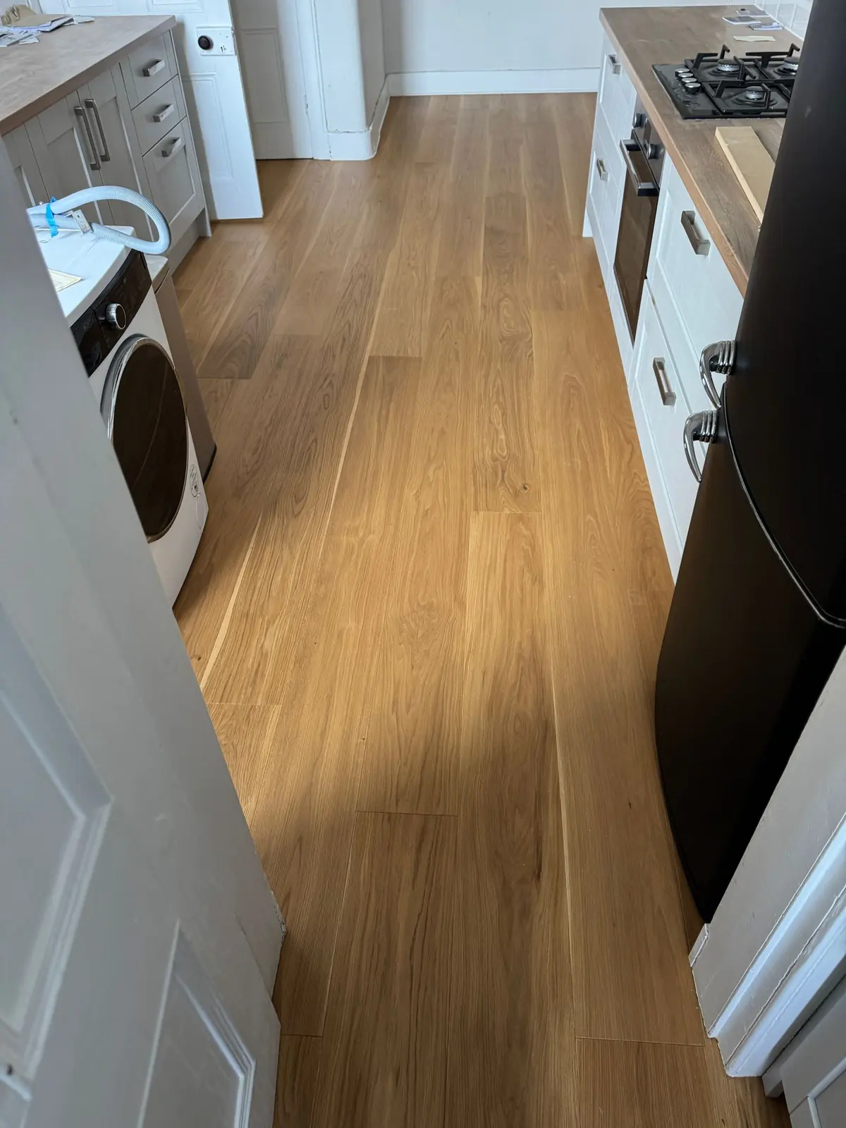 Oak planks running the length of the kitchen