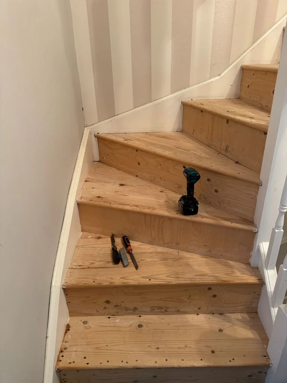 Old softwood winder staircase before oak stair cladding in an Edinburgh home