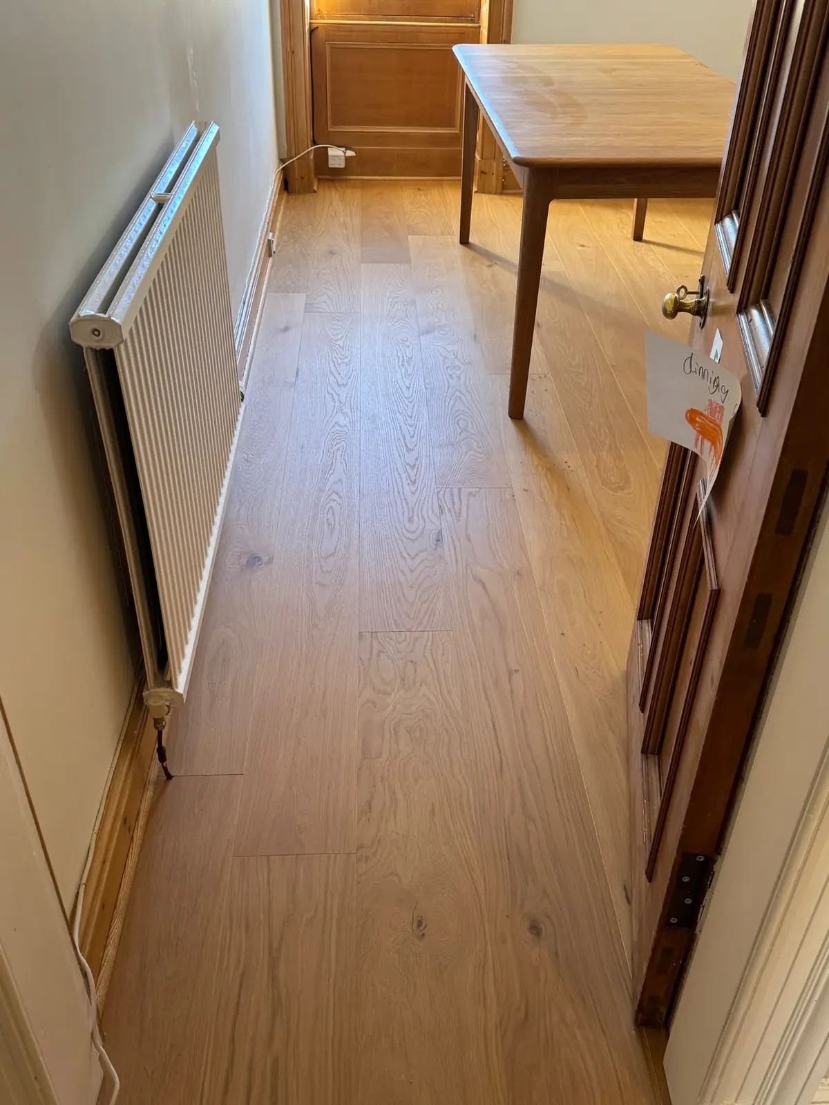 Oak planks running towards a period window