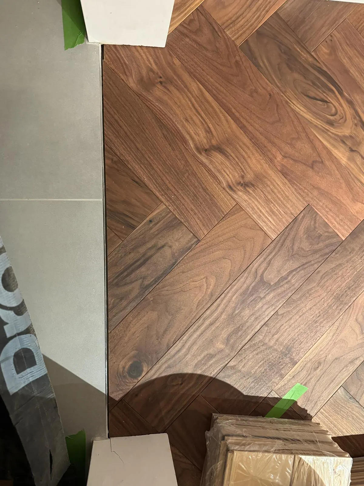 American walnut herringbone parquet in a living area with a hardwax oil finish
